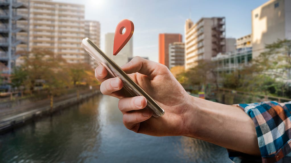 Man holding a phone with GPS enabled.
Business data monitoring